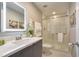 Modern bathroom with a sleek vanity, glass-enclosed shower, and contemporary fixtures for a spa-like experience at 4417 Le Reve Ct, Kissimmee, FL 34746