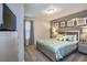 Tranquil bedroom featuring a serene color palette, soft lighting, and comfortable furnishings for a peaceful ambiance at 4417 Le Reve Ct, Kissimmee, FL 34746