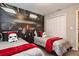 Themed bedroom with two beds, unique wall art, and coordinated decor, perfect for or guests at 4417 Le Reve Ct, Kissimmee, FL 34746