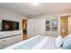 Nicely appointed bedroom with a dresser, closet, and ensuite bathroom for convenience and privacy at 4417 Le Reve Ct, Kissimmee, FL 34746