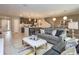 Spacious living area with an open layout, modern kitchen, and stylish furnishings, perfect for entertaining at 4417 Le Reve Ct, Kissimmee, FL 34746
