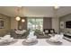 Bright living area with a dining space, comfortable seating, and access to a screened patio at 4417 Le Reve Ct, Kissimmee, FL 34746