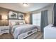 Comfortable main bedroom featuring a plush bed, soft lighting, and stylish decor for a relaxing retreat at 4417 Le Reve Ct, Kissimmee, FL 34746