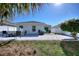 Backyard featuring a paved patio with outdoor furniture, a well-maintained lawn, and a white privacy fence at 4677 Glencrest Loop, St Cloud, FL 34772
