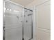 Shower features tile and glass doors at 4677 Glencrest Loop, St Cloud, FL 34772