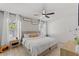 Spacious bedroom features large windows with natural light, ceiling fan, and neutral decor at 4677 Glencrest Loop, St Cloud, FL 34772