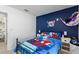 Comfortable bedroom featuring a cozy bed with Spiderman-themed bedding and side tables, perfect for children at 4677 Glencrest Loop, St Cloud, FL 34772