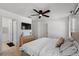 Bedroom featuring a ceiling fan, dresser, and TV at 4677 Glencrest Loop, St Cloud, FL 34772