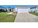 Well maintained lawn and landscaping accent the exterior of this home with a long driveway to a two-car garage at 4677 Glencrest Loop, St Cloud, FL 34772