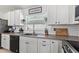 Close up of bright kitchen features tiled backsplash and stainless steel appliances at 4677 Glencrest Loop, St Cloud, FL 34772