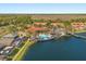 Panoramic aerial view featuring a community pool, lake, and residential buildings at 4692 Sw Golden Beach N Ct, Kissimmee, FL 34746
