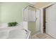 Bathroom featuring a garden tub, a shower, and neutral walls at 4692 Sw Golden Beach N Ct, Kissimmee, FL 34746