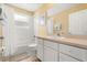Bright bathroom with white cabinets, shower/tub combination, and neutral tile at 4692 Sw Golden Beach N Ct, Kissimmee, FL 34746