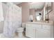 Bathroom with vanity, toilet, shower and butterfly shower curtain at 4692 Sw Golden Beach N Ct, Kissimmee, FL 34746