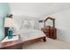 Bedroom with wood floors, light walls, and a large dresser at 4692 Sw Golden Beach N Ct, Kissimmee, FL 34746