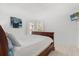 Light-filled bedroom with decorative wall art and neutral finishes at 4692 Sw Golden Beach N Ct, Kissimmee, FL 34746
