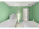 Bright guest bedroom with twin beds and an adjoining closet at 4692 Sw Golden Beach N Ct, Kissimmee, FL 34746