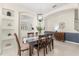 Elegant dining room with stylish chandelier, display shelving and wood dining set at 4692 Sw Golden Beach N Ct, Kissimmee, FL 34746