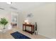 Hallway with wood floors, a blue rug, and light-colored walls at 4692 Sw Golden Beach N Ct, Kissimmee, FL 34746