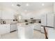 Bright kitchen with white cabinetry, stainless appliances, and a center island at 4692 Sw Golden Beach N Ct, Kissimmee, FL 34746
