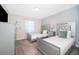 Guest bedroom with two beds, plush carpeting, and a dresser with a television at 4835 Lullaby Ln, Kissimmee, FL 34746