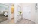 Bright and welcoming foyer with tile flooring and decorative console table at 4835 Lullaby Ln, Kissimmee, FL 34746