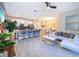 Open-concept area showcases the kitchen, dining and living spaces and features modern decor at 4835 Lullaby Ln, Kissimmee, FL 34746