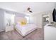 Bright bedroom with plush carpeting, a ceiling fan, and an ensuite bathroom at 4835 Lullaby Ln, Kissimmee, FL 34746