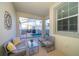 Covered outdoor seating area overlooks the pool at 4835 Lullaby Ln, Kissimmee, FL 34746