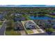 Aerial view of home showing proximity to pond and other residences in the neighborhood at 545 Fairhaven Dr, Davenport, FL 33837