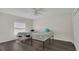 Bedroom featuring two beds, a ceiling fan, and wood flooring at 545 Fairhaven Dr, Davenport, FL 33837