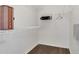 Walk-in closet with white wire shelving and a wooden fire extinguisher box at 545 Fairhaven Dr, Davenport, FL 33837