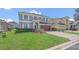 Charming two-story home featuring manicured landscaping and an attached two-car garage, under a sunny sky at 545 Fairhaven Dr, Davenport, FL 33837