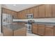 Spacious kitchen with stainless steel appliances, granite countertops and ample cabinet space at 545 Fairhaven Dr, Davenport, FL 33837
