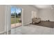 Living room featuring tile flooring, an exterior view and lots of open space at 545 Fairhaven Dr, Davenport, FL 33837