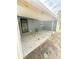 Covered carport with finished floor and side door access offers protected parking and utility at 6337 Lido Ct, Orlando, FL 32807