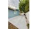 Spacious paved driveway, adjacent to a white fence, with convenient side yard access at 6337 Lido Ct, Orlando, FL 32807