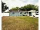 Charming single-story home featuring a well-maintained lawn, and a single car garage at 6337 Lido Ct, Orlando, FL 32807