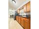 Eat-in kitchen featuring tile floors, granite counters, and stainless steel refrigerator at 6337 Lido Ct, Orlando, FL 32807