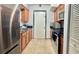Kitchen with stainless steel appliances, tile floor and lots of cabinets and counter space at 6337 Lido Ct, Orlando, FL 32807
