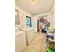 This laundry room has tile floors, a washer and dryer, and storage space at 6337 Lido Ct, Orlando, FL 32807