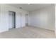 Bright bedroom featuring carpet flooring, a closet, and soft, neutral walls at 64 Citrine Loop, Kissimmee, FL 34758