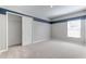 Bedroom with a blue stripe accent, carpet floors, and a closet at 64 Citrine Loop, Kissimmee, FL 34758