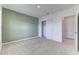 Comfortable bedroom featuring carpet flooring, a large window, and a closet at 64 Citrine Loop, Kissimmee, FL 34758