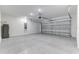 Spacious two-car garage features epoxy floor, water heater and ample lighting at 64 Citrine Loop, Kissimmee, FL 34758