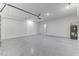 Spacious two-car garage features epoxy floor, water heater and ample lighting at 64 Citrine Loop, Kissimmee, FL 34758