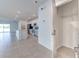 Spacious kitchen with stainless steel appliances and a breakfast bar overlooking the living area at 64 Citrine Loop, Kissimmee, FL 34758
