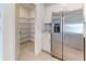 The home has a walk-in pantry with wire shelving and ample storage space at 64 Citrine Loop, Kissimmee, FL 34758