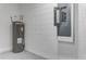 Functional utility area with modern water heater and electric panel at 64 Citrine Loop, Kissimmee, FL 34758