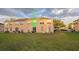Spacious grassy backyard with sliding doors and patio furniture at 645 Captiva Cir, Kissimmee, FL 34741